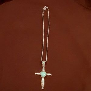 Silver metal cross necklace with turquoise stones